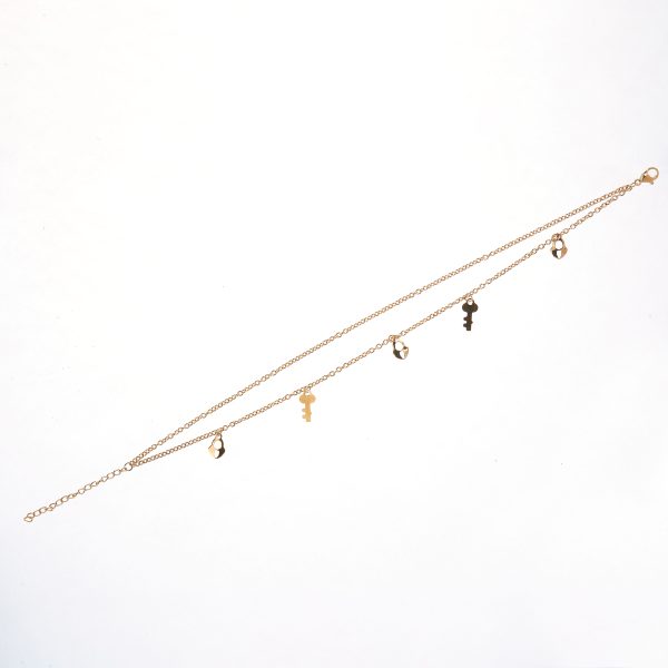 Tobillera de doble cadena con dijes de llave y candado